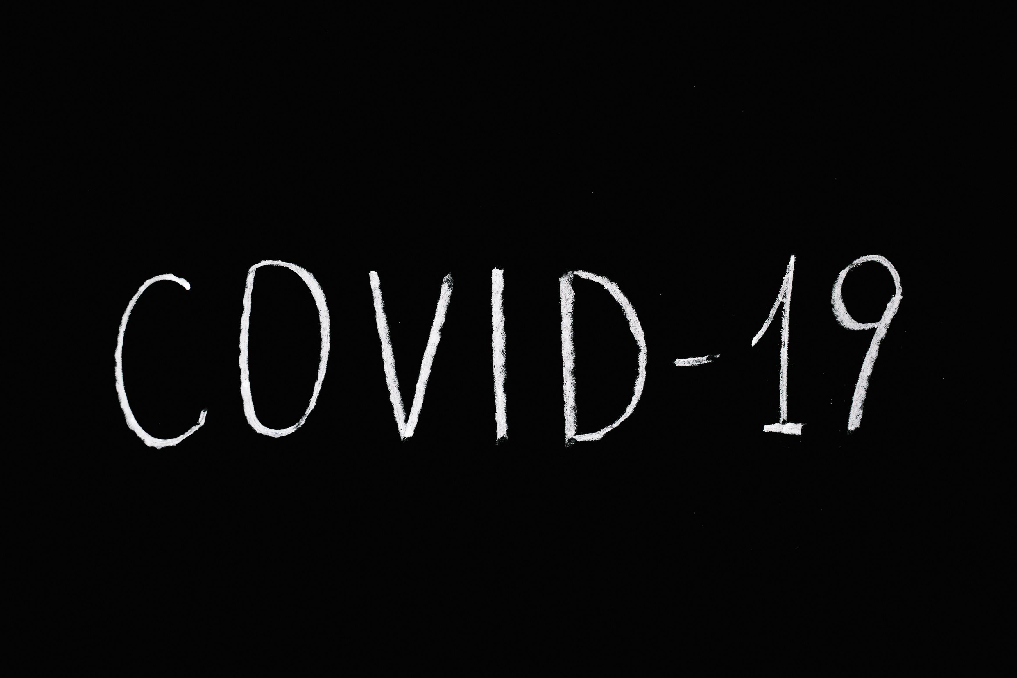 Covid-19 Lettering White Text on Black Background